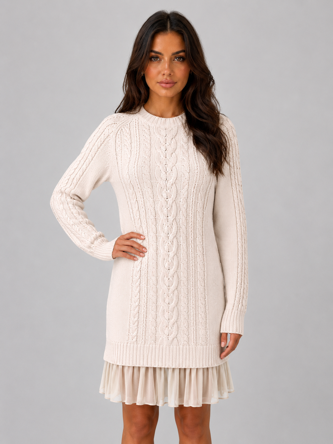 Women's cream cable knit mini dress with pleated hem, front view