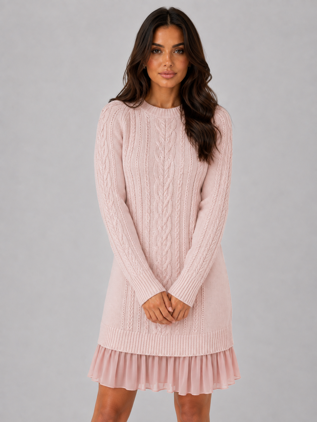 Women's pink cable knit mini dress with pleated hem, front view